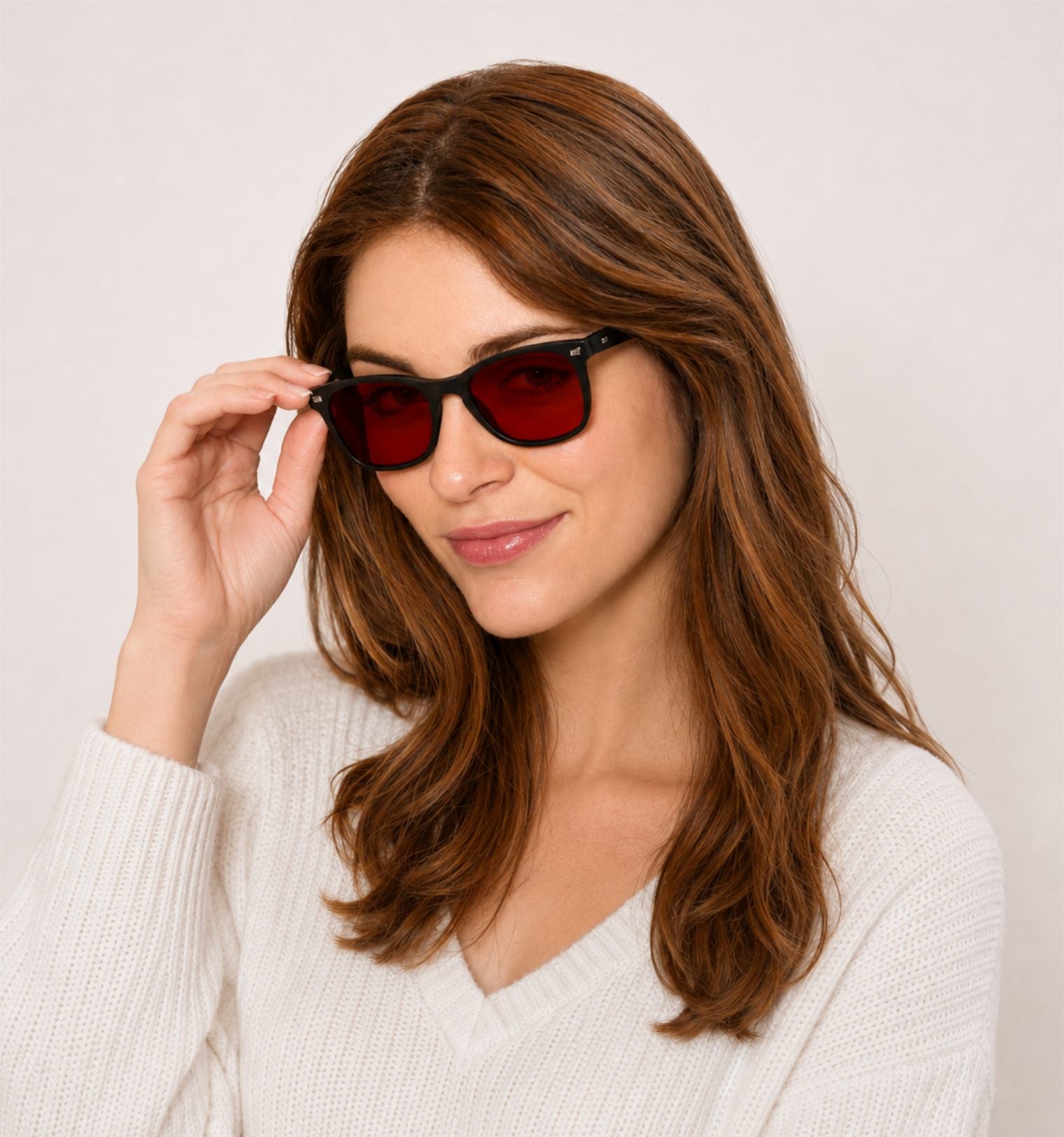 Woman wearing Ember blue light sleep glasses